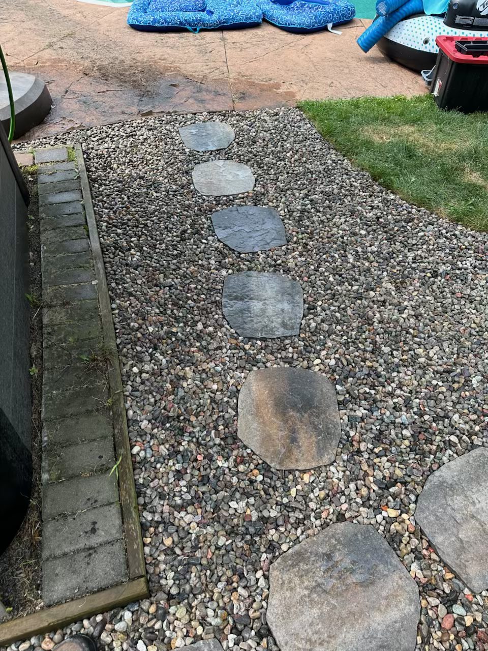 Revived section of Margaret's Barrhaven property showing clean garden space after complete overgrowth removal