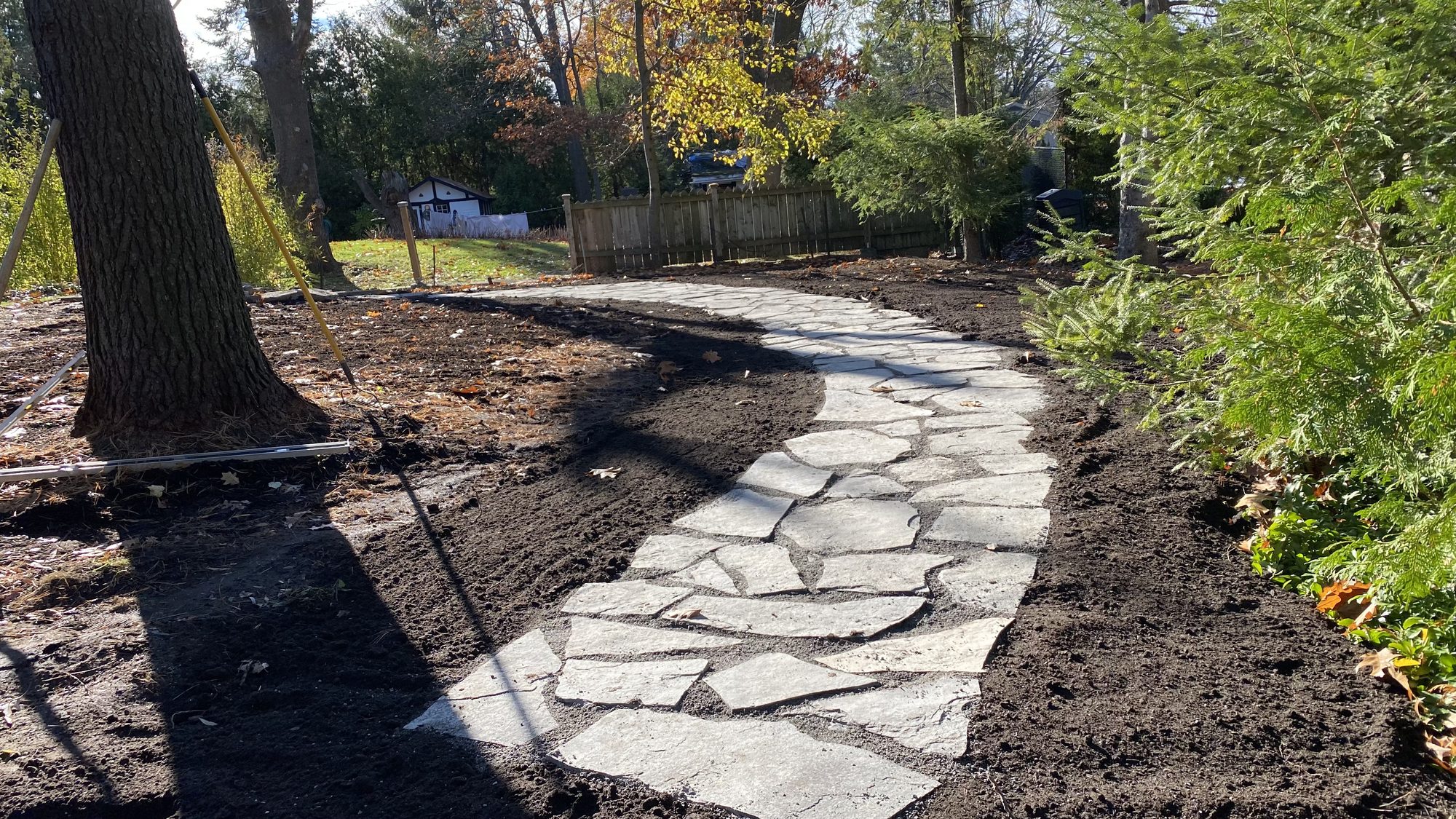 Flagstone pathway flowing curves designed for walker accessibility in Nepean backyard