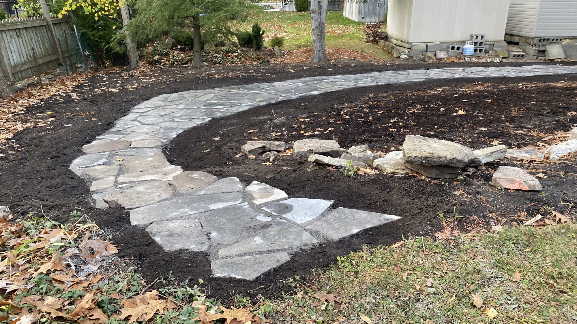 Flagstone detail showing careful natural stone selection for garden pathway