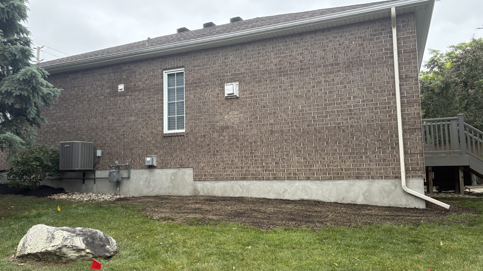 Restored property border showing clean transition between lawn and garden bed