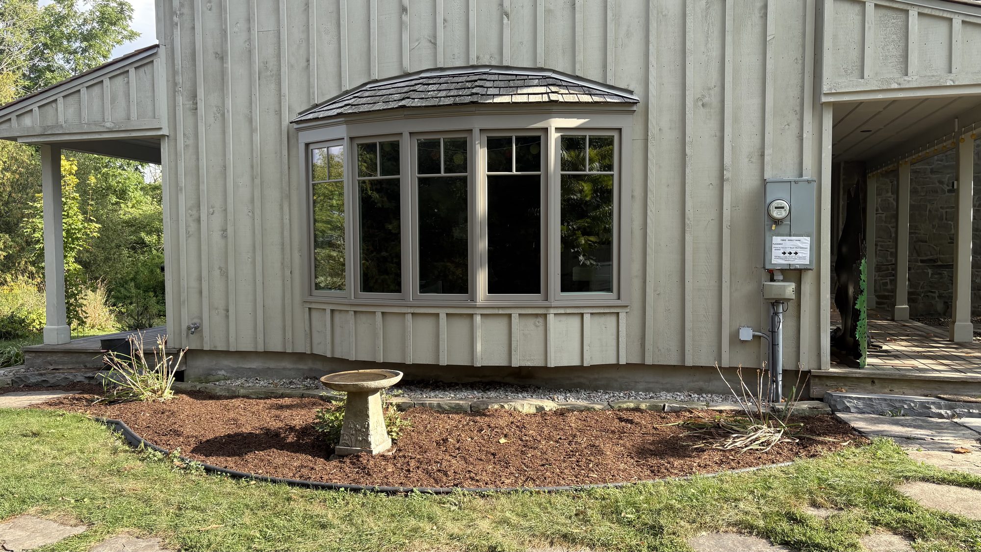 Revived walkway and garden beds along fence line after professional cleanup in Winchester