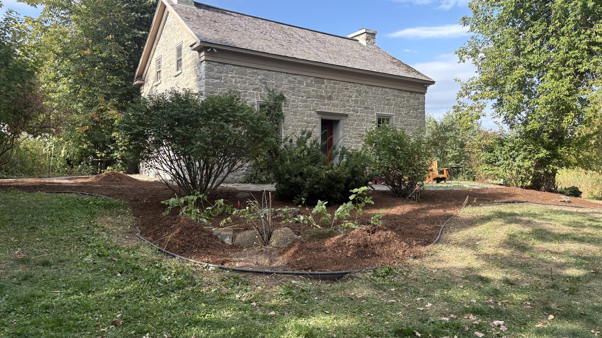 Restored property border with neat hedges and defined landscape edges