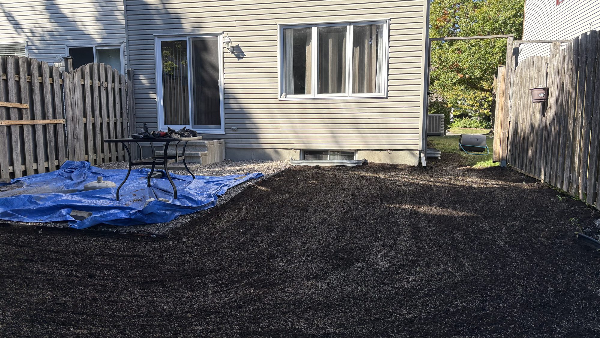 Clean garden beds and freshly seeded lawn area on Barrhaven property prepared for sale