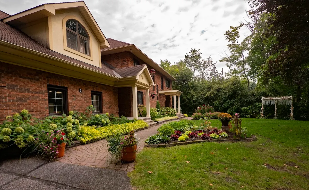 Full front garden view of a well-maintained Ottawa property